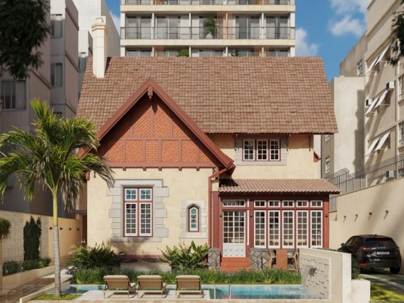 Casa histórica de telhado inclinado e janelas brancas, com jardim e piscina na frente e a torre ao fundo