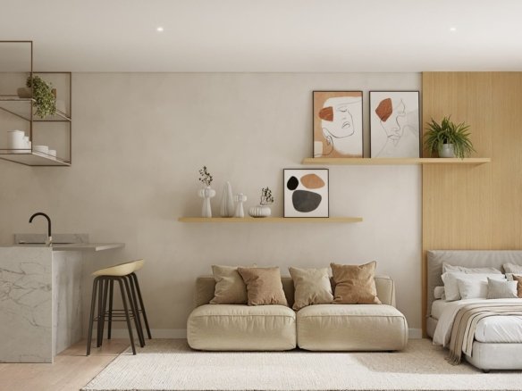 Unidade integrada com cozinha, sofá e cama, e porta de vidro para a área externa
