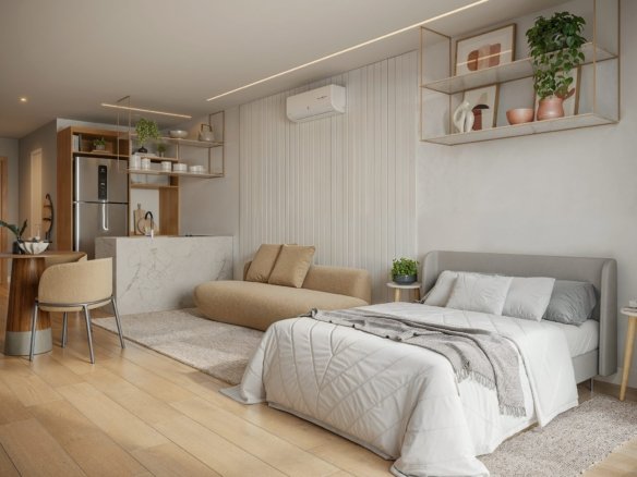 Studio com cama, sofá, cozinha com bancada e ar-condicionado