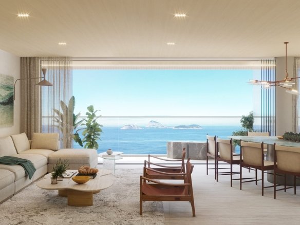 Sala de estar e jantar integradas, com sofá em L, mesa para oito lugares e esquadria de vidro aberta para a varanda, com o mar e as Ilhas Cagarras ao fundo.